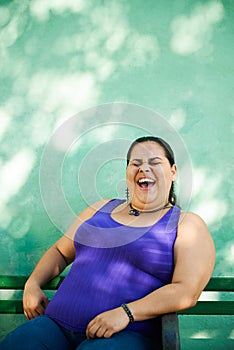 Portrait of fat woman looking at camera and smiling