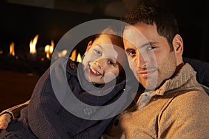 Portrait father and daughter by firelight