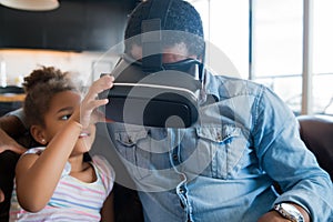 Father and daughter playing video games. photo