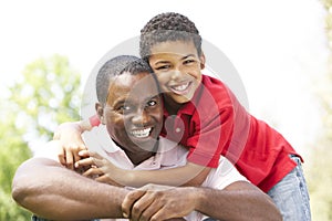 Portrait Of Father And Son In Park