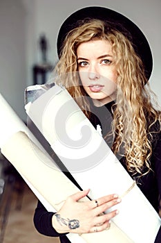 Portrait of Feemale Artist With Paper Roll