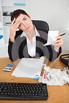 Portrait of a female accountant checking receipts