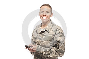 Portrait of female airman with mobile phone photo