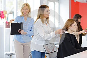 portrait female apprentice hairdresser
