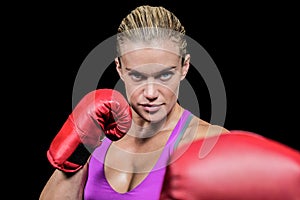 Portrait of female boxer with fighting stance