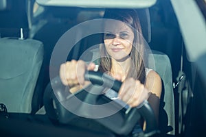 Portrait of female caucasian driver in car