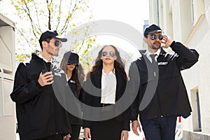 Portrait Of Female Celebrity With Bodyguards