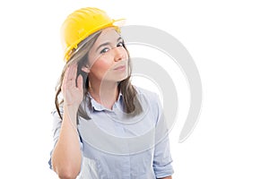 Portrait of female constructor showing can`t hear you photo