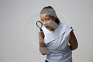 Portrait Of Female Criminologist With Magnifying Glass photo