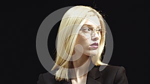 Portrait Of Female Customer Services Agent. Business woman working. Young smiling business woman isolated over black