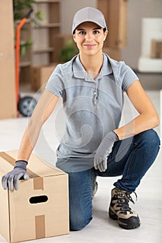 Portrait female deliverywoman posing