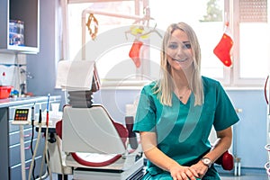 Portrait of female dentist in her dentist office.