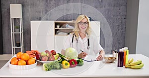 Portrait Of Female Dietician With Vegetables