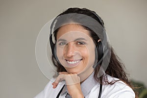 Portrait of female doctor in headset have webcam call