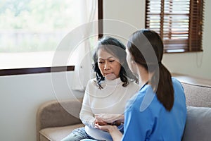 Portrait of a female doctor holding a patient& x27;s hand to encourage the fight against disease.