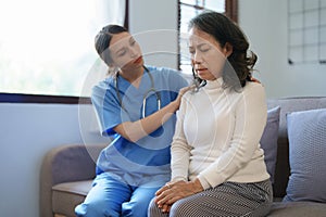 Portrait of a female doctor holding a patient& x27;s hand to encourage the fight against disease.