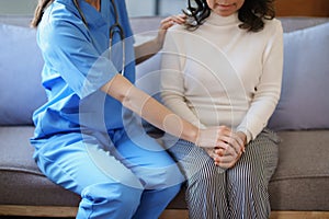 Portrait of a female doctor holding a patient& x27;s hand to encourage the fight against disease.