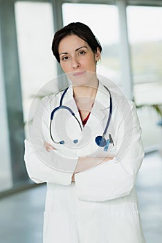 portrait female doctor in hospital lobby