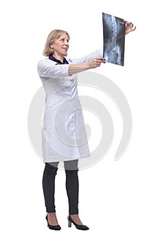 Portrait of a female doctor looking at a X-ray