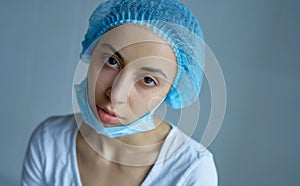 Portrait female doctor or nurse in uniform feeling down, exhausted, frustrated, very tired after receive patients in