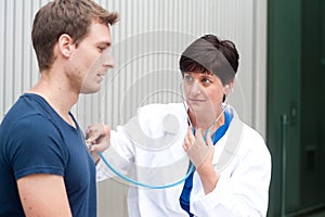 Portrait of female doctor with patient