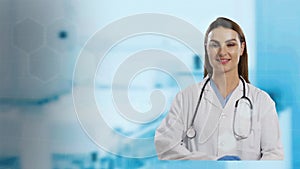 Portrait of female doctor smiling against hospital in background