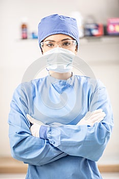 Portrait of female doctor in special surgical sterile protective clothing