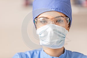 Portrait of female doctor in special surgical sterile protective clothing