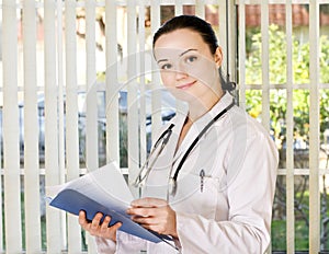 Portrait of female doctor standing