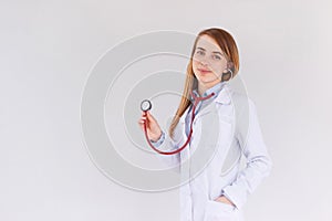 Portrait of female doctor using stethoscope