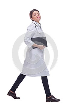 Portrait of female doctor walking towards the camera smiling