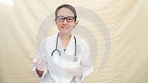 Portrait female doctor wearing medical mask and glove isolated in white background. working on a folder in inflatable Hospital,