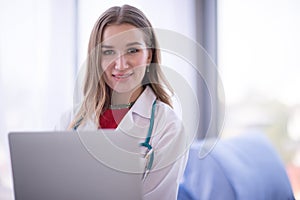 Portrait Of Female Doctor Wearing White Coat with stethoscope