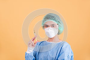 Portrait of  female doctor on yellow background.