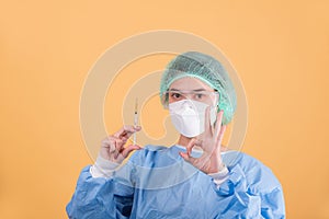 Portrait of  female doctor on yellow background.