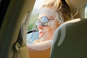 Portrait of female driver with sunglasses