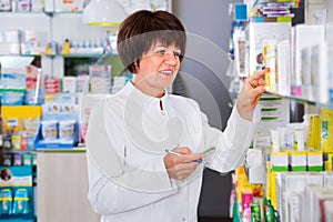 Portrait of female druggist working in pharmacy