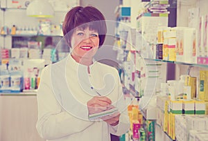 Portrait of female druggist working in pharmacy