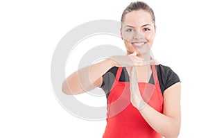 Portrait of female employee doing timeout gesture photo