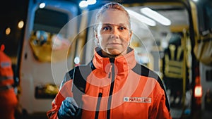 Portrait of a Female EMS Paramedic Proudly Standing in Front of Camera in High Visibility Medical