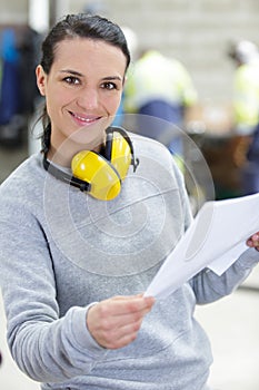 portrait female engineer in factory