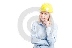 Portrait female engineer making thinking gesture