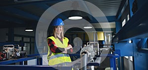 Portrait of female engineer working in industrial factory