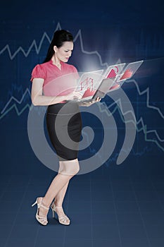 Female entrepreneur with declining graph photo