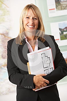 Portrait Of Female Estate Agent In Office