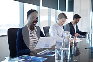 Portrait of female executive holding graph