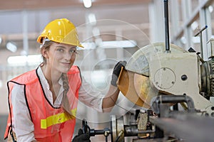 Portrait of female factory worker working in line production at a factory Industrial