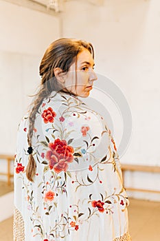 portrait of a female flamenco dancer with shawl on her back