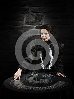 Portrait of a female fortuneteller with the cards