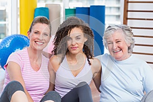 Portrait of female friends sitting in gym